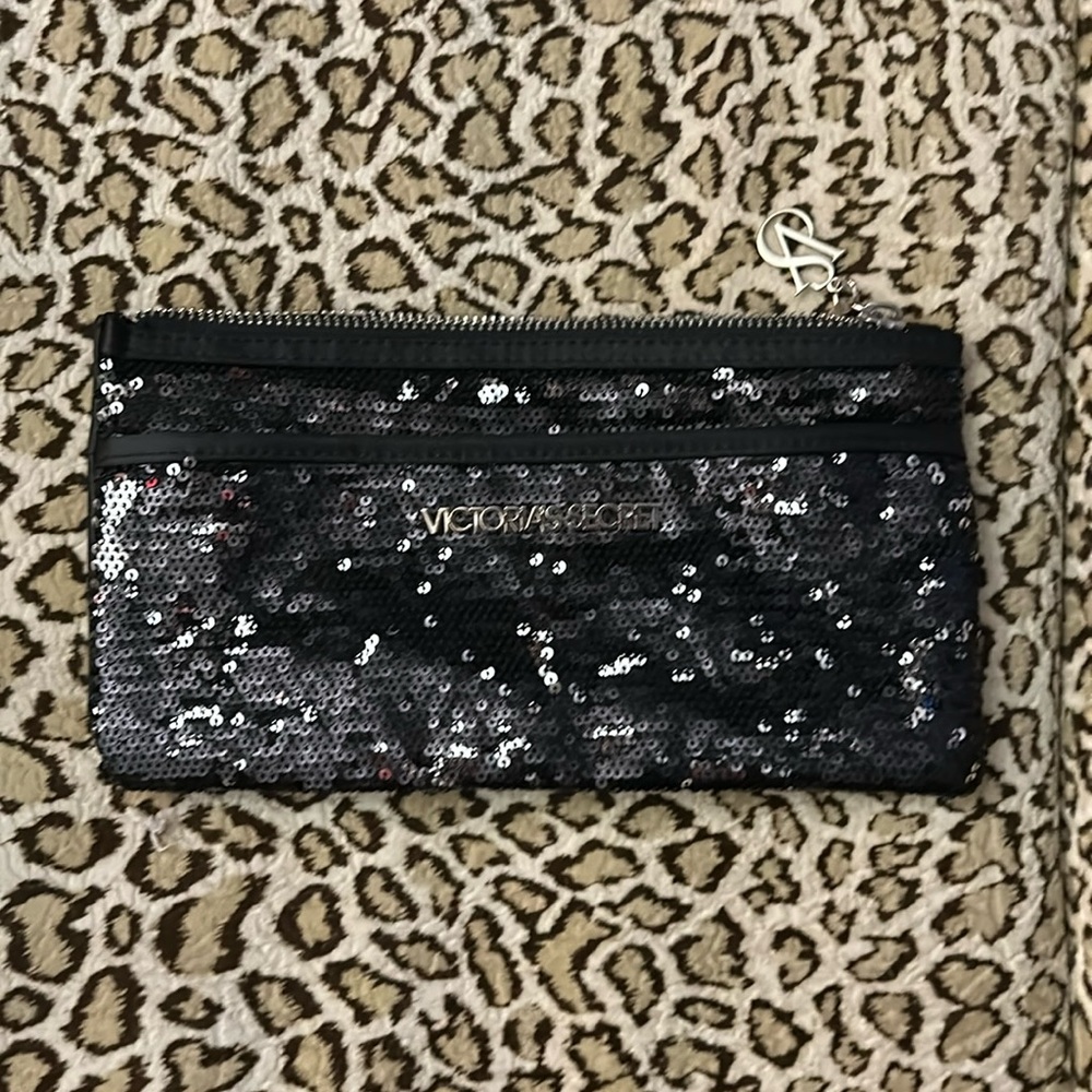 Victoria’s Secret sequin clutch in black, but has a shimmer of silver